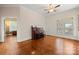 Bedroom featuring hardwood floors and a ceiling fan at 6218 Indian Trail Fairview Rd, Indian Trail, NC 28079