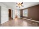 Bedroom with an ensuite bathroom features neutral wall colors and coordinating floor tiles at 6218 Indian Trail Fairview Rd, Indian Trail, NC 28079