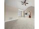 The primary bedroom features a neutral carpet, vaulted ceilings, and an ensuite bathroom at 6218 Indian Trail Fairview Rd, Indian Trail, NC 28079