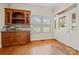 A bright dining room with a beautiful wooden cabinet and door to the outside at 6218 Indian Trail Fairview Rd, Indian Trail, NC 28079