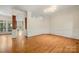 A bright dining room featuring hardwood floors and detailed trim at 6218 Indian Trail Fairview Rd, Indian Trail, NC 28079