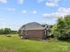Beautiful brick house with lush yard and established foliage, perfect for enjoying the peaceful surroundings at 6218 Indian Trail Fairview Rd, Indian Trail, NC 28079