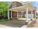 Elegant brick home featuring a porte cochere, a well-manicured lawn, and a welcoming entrance at 6218 Indian Trail Fairview Rd, Indian Trail, NC 28079