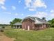 Charming brick home with a covered gazebo, lush yard, and a serene setting for comfortable living at 6218 Indian Trail Fairview Rd, Indian Trail, NC 28079