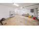 Bright and clean garage featuring white walls, a concrete floor, and ample space for storage at 6218 Indian Trail Fairview Rd, Indian Trail, NC 28079