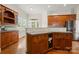 Kitchen with custom wood cabinets, gray countertop, and stainless steel appliances at 6218 Indian Trail Fairview Rd, Indian Trail, NC 28079