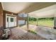 Covered porch with classic brick flooring, inviting seating, and a glimpse of the home's exterior features at 6218 Indian Trail Fairview Rd, Indian Trail, NC 28079