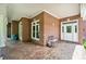 Spacious brick-covered porch featuring seating and direct access to multiple entrances at 6218 Indian Trail Fairview Rd, Indian Trail, NC 28079