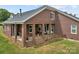 Beautiful brick house with a covered porch and spacious yard, ideal for outdoor entertaining and leisure at 6218 Indian Trail Fairview Rd, Indian Trail, NC 28079