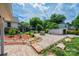 Expansive backyard with brick patio, fire pit, storage shed, and lush landscaping at 625 2Nd Ne St, Hickory, NC 28601