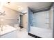 Bathroom with a tub and shower combo, white tile, and a sink vanity at 625 2Nd Ne St, Hickory, NC 28601