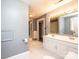 Neutral bathroom with a double sink vanity, a large mirror with vanity lighting and tile flooring at 625 2Nd Ne St, Hickory, NC 28601