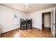 Bedroom with hardwood floors and a washer and dryer in the corner at 625 2Nd Ne St, Hickory, NC 28601