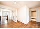 Spacious bedroom featuring hardwood floors and open doorway to staircase at 625 2Nd Ne St, Hickory, NC 28601