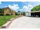 Exterior view with a driveway leading to a detached garage on a sunny day at 625 2Nd Ne St, Hickory, NC 28601