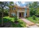 Charming brick two-story home with red front door and well-maintained front yard at 625 2Nd Ne St, Hickory, NC 28601