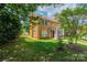 Beautiful two-story brick home with a lush green lawn and a red door at 625 2Nd Ne St, Hickory, NC 28601