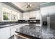 Well-lit kitchen with white cabinets, modern appliances, and center island at 625 2Nd Ne St, Hickory, NC 28601