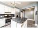 Kitchen with white cabinetry, stainless appliances, and functional center island at 625 2Nd Ne St, Hickory, NC 28601