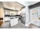 Spacious kitchen featuring white cabinets, stainless steel appliances, and tile flooring at 625 2Nd Ne St, Hickory, NC 28601