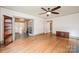Open concept living room with hardwood floors, decorative fireplace, and many large windows at 625 2Nd Ne St, Hickory, NC 28601