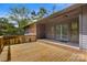 Spacious wooden deck with blue french doors, perfect for outdoor entertaining at 7221 Leaves Ln, Charlotte, NC 28213