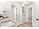 Bathroom with a granite countertop, white cabinets, and built-in shelving for a clean design at 7221 Leaves Ln, Charlotte, NC 28213