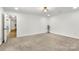 This bedroom has neutral carpet and white walls creating a calm and serene environment at 7221 Leaves Ln, Charlotte, NC 28213