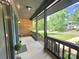 Inviting covered porch with gray railing and ample space, overlooking a well-maintained lawn at 7221 Leaves Ln, Charlotte, NC 28213