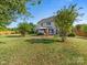 Large backyard with a patio under a pavilion at the back of the house at 7325 Forrest Rader Dr, Mint Hill, NC 28227