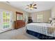 Spacious bedroom features a ceiling fan, a door to the backyard, and plenty of natural light at 7325 Forrest Rader Dr, Mint Hill, NC 28227