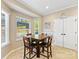 Comfortable dining area filled with sunlight and views into the back yard at 7325 Forrest Rader Dr, Mint Hill, NC 28227