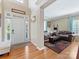 Welcoming entryway with hardwood floors, ample natural light, and an open view into the living room at 7325 Forrest Rader Dr, Mint Hill, NC 28227