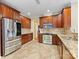 Stylish kitchen with stainless appliances, ample counter space, and wood cabinets at 7325 Forrest Rader Dr, Mint Hill, NC 28227