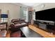 Relaxing living area complete with a large television and comfortable seating, perfect for entertaining at 7325 Forrest Rader Dr, Mint Hill, NC 28227