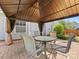 Outdoor patio under a pavilion with a round table and matching chairs at 7325 Forrest Rader Dr, Mint Hill, NC 28227
