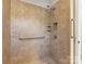 Shower with tile surround, grab bars, and shower caddy for storing shower necessities at 7325 Forrest Rader Dr, Mint Hill, NC 28227