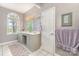 Bathroom with a large vanity, dual sinks and a window that provides natural lighting at 7525 Windy Pine Cir, Denver, NC 28037
