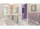 Bathroom with a dual sink vanity, and an open doorway to another room at 7525 Windy Pine Cir, Denver, NC 28037