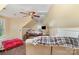 Upper level bedroom with neutral paint, large ceiling fan, and media area, perfect for relaxing and unwinding at 7525 Windy Pine Cir, Denver, NC 28037