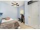 Cozy bedroom featuring blue walls, a ceiling fan, and comfortable space at 7525 Windy Pine Cir, Denver, NC 28037