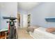 Bedroom showcasing blue walls, a ceiling fan, and space for exercise equipment at 7525 Windy Pine Cir, Denver, NC 28037