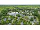 Serene aerial view of a lakeside community, highlighting lush greenery and well-maintained homes near the water at 7811 Compton Ct, Charlotte, NC 28270