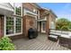 Outdoor deck featuring a grill, patio furniture, and a view of the landscaped backyard at 7811 Compton Ct, Charlotte, NC 28270