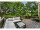 Inviting back deck with comfortable seating and views of a lush, green landscape at 7811 Compton Ct, Charlotte, NC 28270