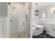 Bright bathroom with soaking tub, shower, dual vanity, and modern fixtures at 7811 Compton Ct, Charlotte, NC 28270