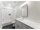 Modern bathroom featuring black tile floors, a white vanity, and a tub-shower combo at 7811 Compton Ct, Charlotte, NC 28270