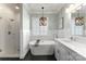 Bright bathroom with soaking tub, shower, dual vanity, and modern fixtures at 7811 Compton Ct, Charlotte, NC 28270