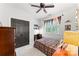 Bright bedroom with plaid bedding, sports pennants, and dark gray closet doors at 7811 Compton Ct, Charlotte, NC 28270