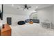 Spacious bonus room with plush seating, a ceiling fan, and lots of natural light at 7811 Compton Ct, Charlotte, NC 28270